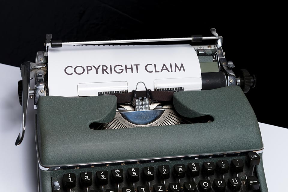 Copyright claim paperwork in a typewriter